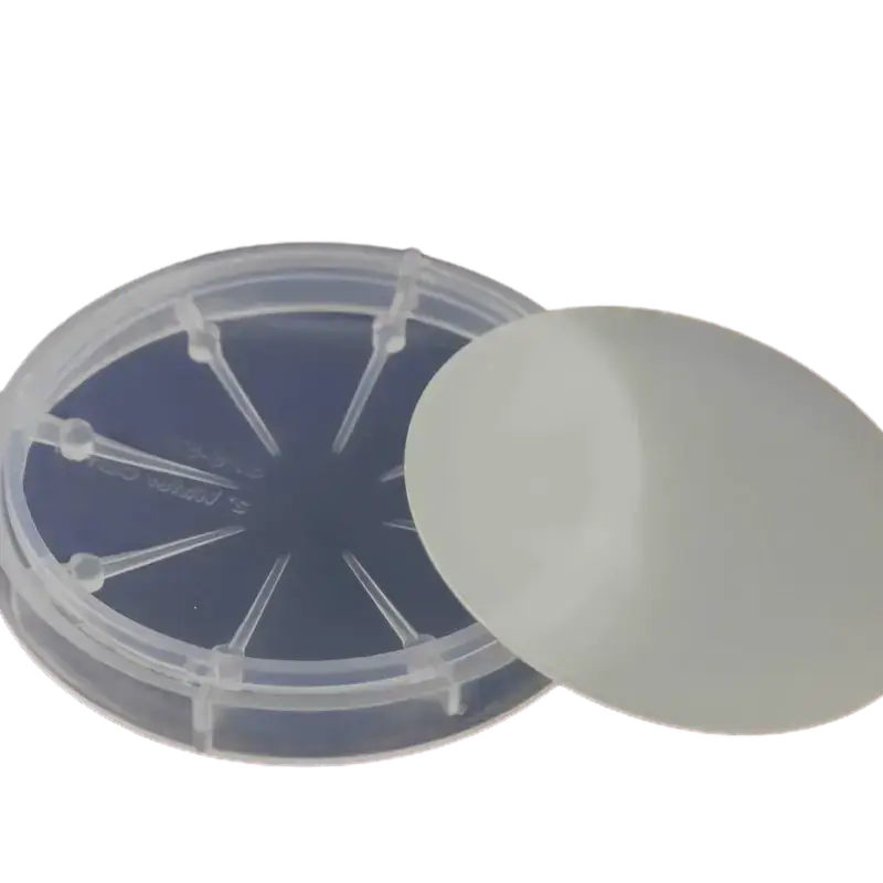 GaN on Sapphire wafer 4inch P GaN Gallium nitride Semiconductor Substrate on a clear holder.